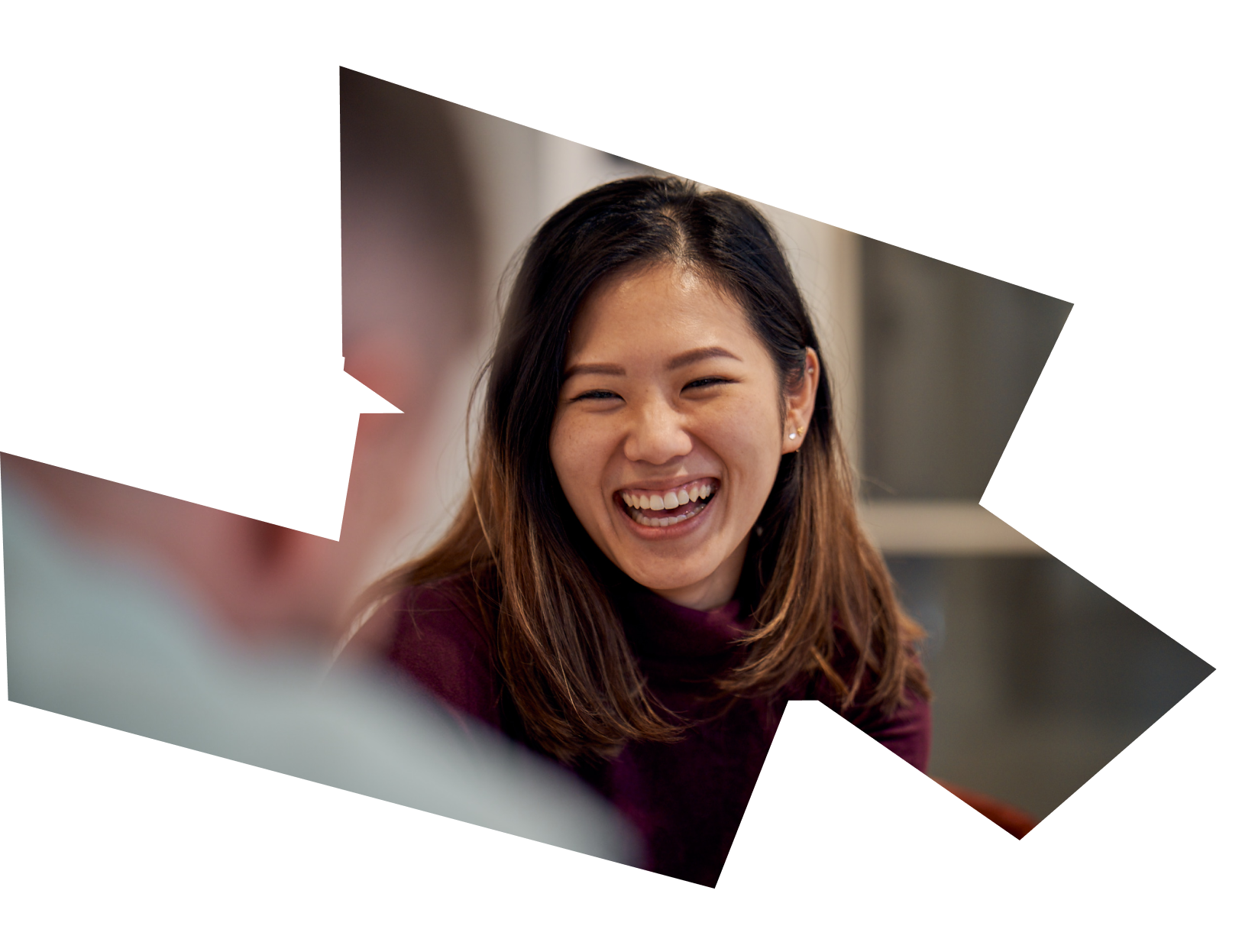 Close up of the face of a young female Asian ByteDance employee as she smiles.